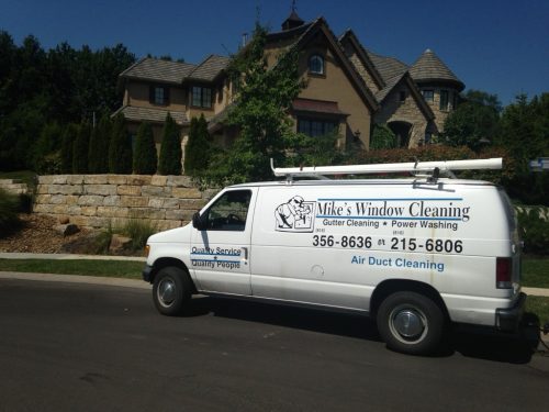 Mike's Window and Gutter Cleaning van parked outside of Kansas City home